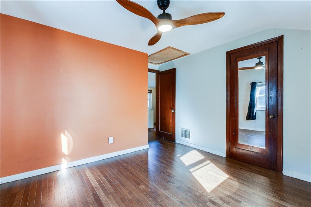 133 Hamburg Street Pittsburgh, PA 15220 - Photo 29 of 41 wooden floor in an empty room with a window