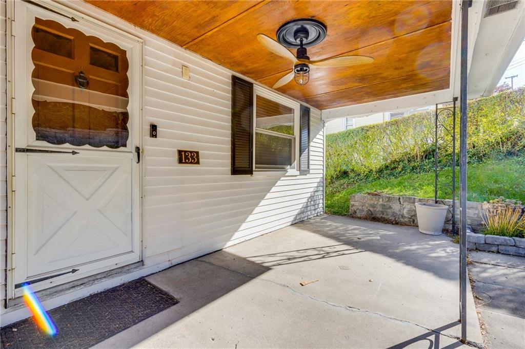 133 Hamburg Street Pittsburgh, PA 15220 - Photo 3 of 41 a porch with a table and chairs