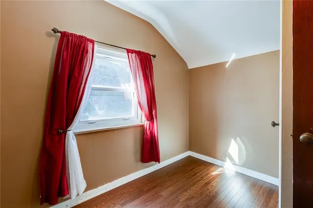 a view of front door with wooden floor