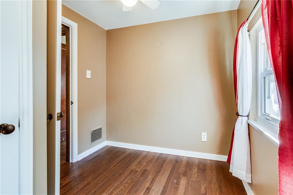 133 Hamburg Street Pittsburgh, PA 15220 - Photo 33 of 41 a view of a room with wooden floor and a window