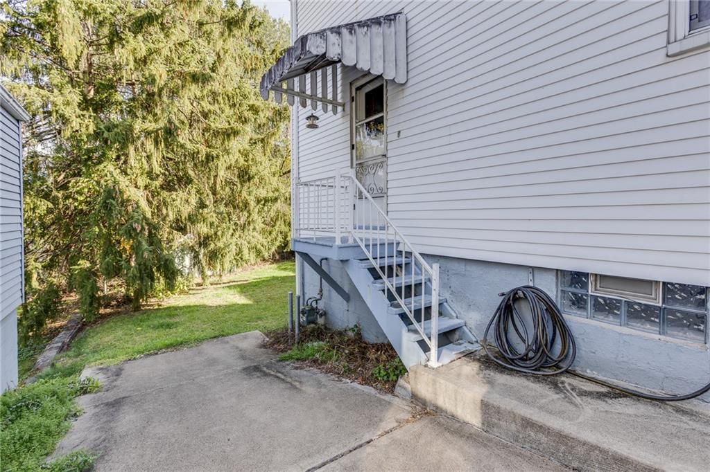 133 Hamburg Street Pittsburgh, PA 15220 - Photo 39 of 41 a view of a patio with a table and chairs