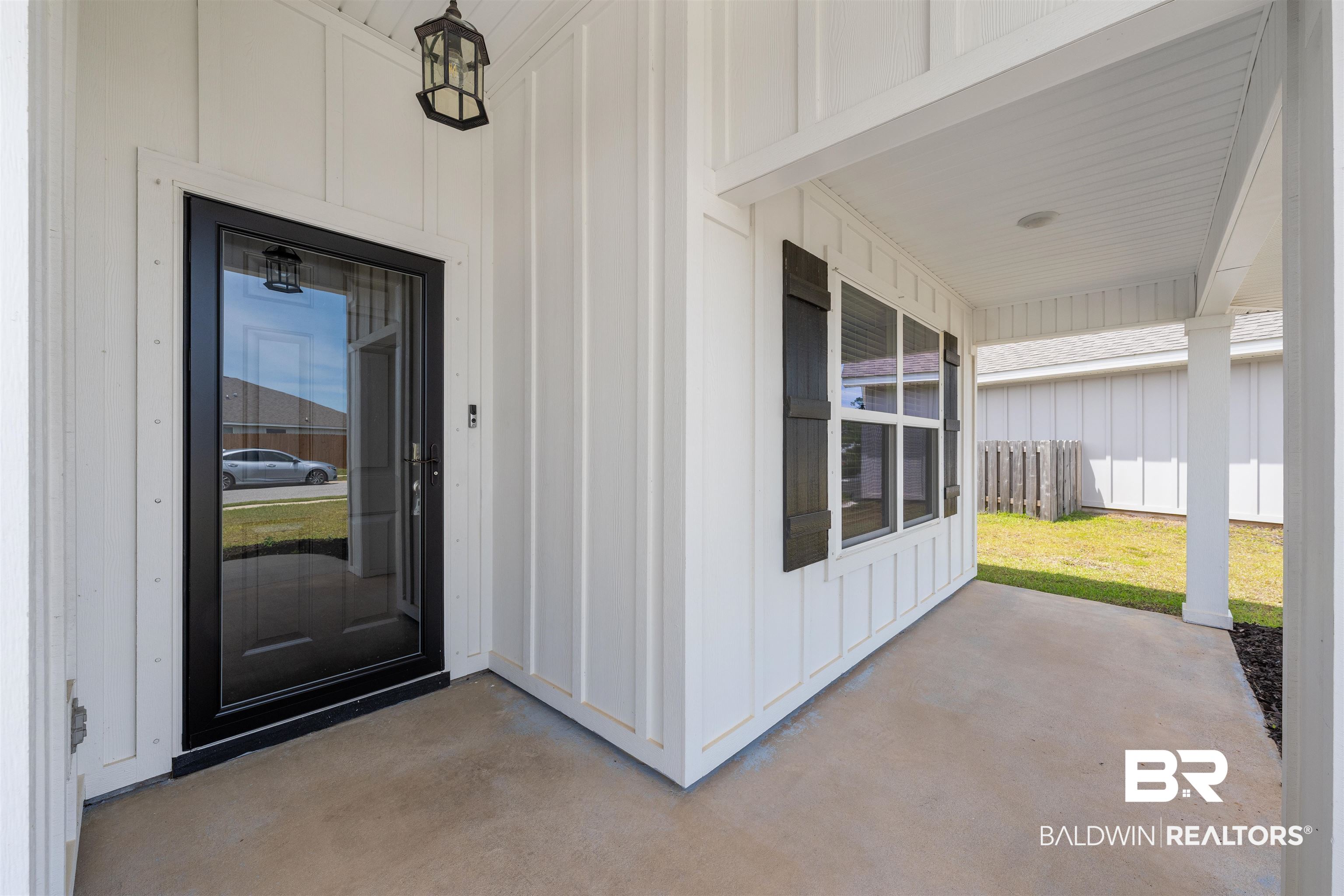 7457 Brompton Drive Foley, AL 36535 - Photo 2 of 24 Doorway to property featuring board and batten siding