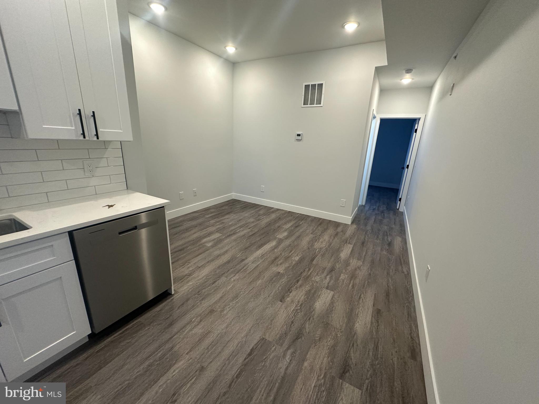 2120 North 7th Street, Unit 3 Philadelphia, PA 19122 - Photo 6 of 9 a view of a kitchen from a hallway