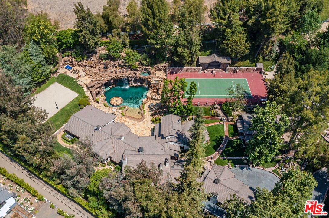 an aerial view of a house with a garden