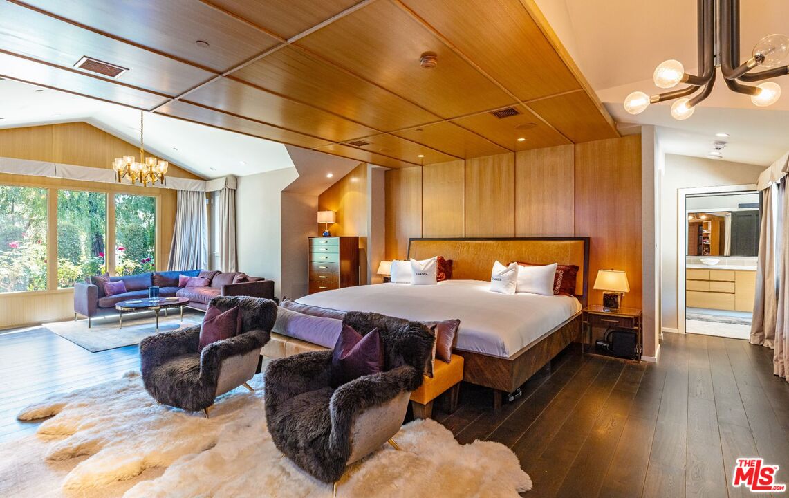 5841 Round Meadow Road Hidden Hills, CA 91302 - Photo 12 of 33 a bed room with a bed and a couch