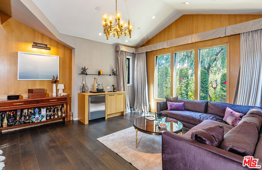 5841 Round Meadow Road Hidden Hills, CA 91302 - Photo 13 of 33 a living room with furniture and a flat screen tv