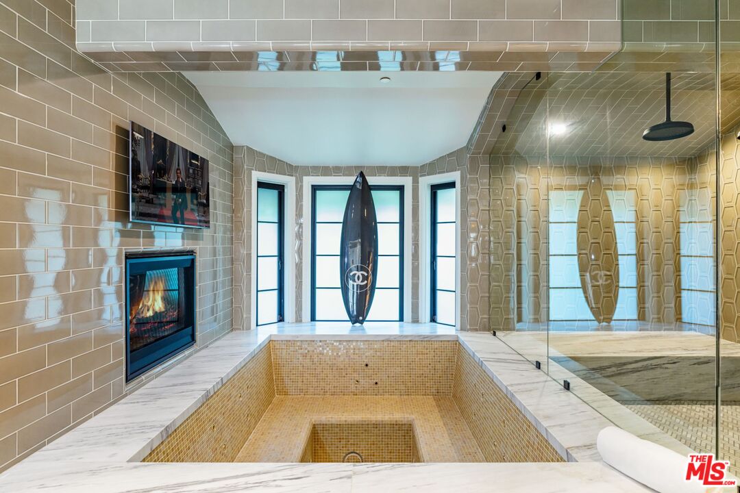 5841 Round Meadow Road Hidden Hills, CA 91302 - Photo 14 of 33 a view of spacious bathroom with a tub and windows