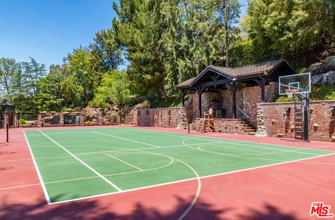 5841 Round Meadow Road Hidden Hills, CA 91302 - Photo 23 of 33 a view of a house with a big yard