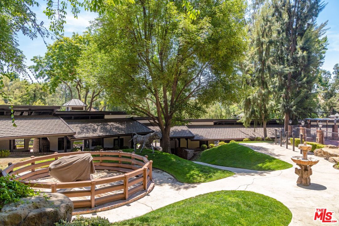 5841 Round Meadow Road Hidden Hills, CA 91302 - Photo 25 of 33 a view of a backyard with sitting area