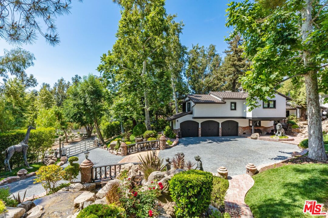 5841 Round Meadow Road Hidden Hills, CA 91302 - Photo 3 of 33 an outdoor view of a garden