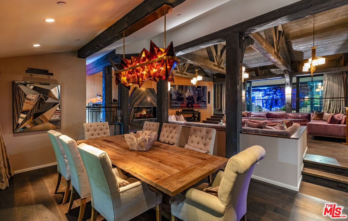 5841 Round Meadow Road Hidden Hills, CA 91302 - Photo 31 of 33 a dining room with furniture and a floor to ceiling window