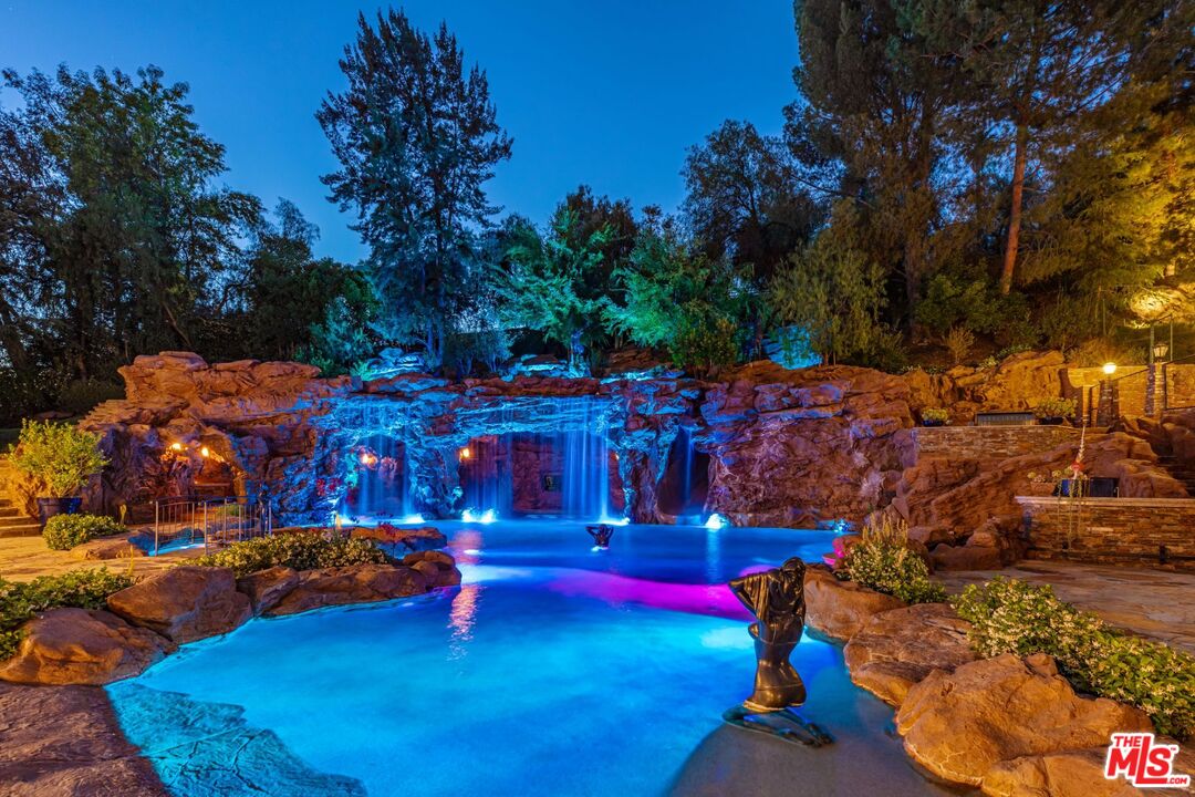 5841 Round Meadow Road Hidden Hills, CA 91302 - Photo 33 of 33 a view of swimming pool with outdoor seating