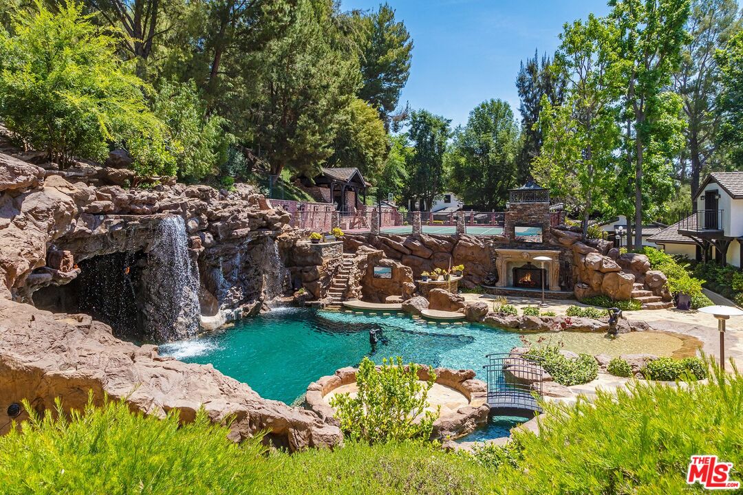 5841 Round Meadow Road Hidden Hills, CA 91302 - Photo 5 of 33 a view of swimming pool patio and outdoor seating