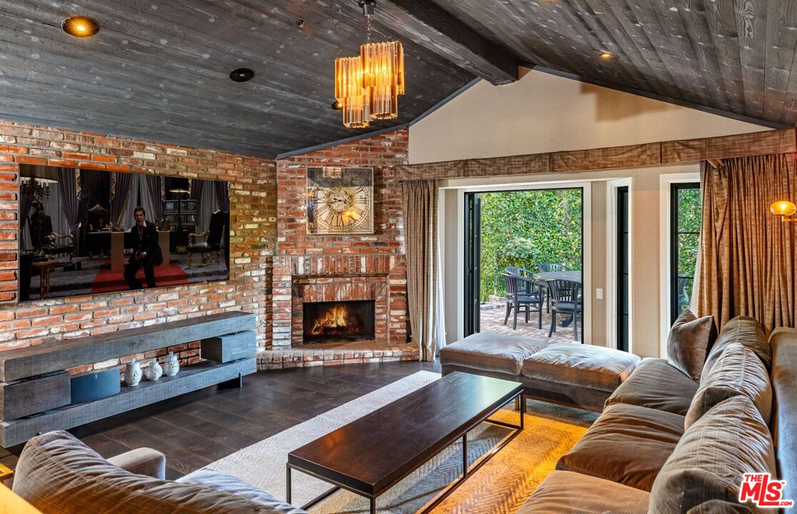 5841 Round Meadow Road Hidden Hills, CA 91302 - Photo 10 of 33 a living room with furniture and a fireplace