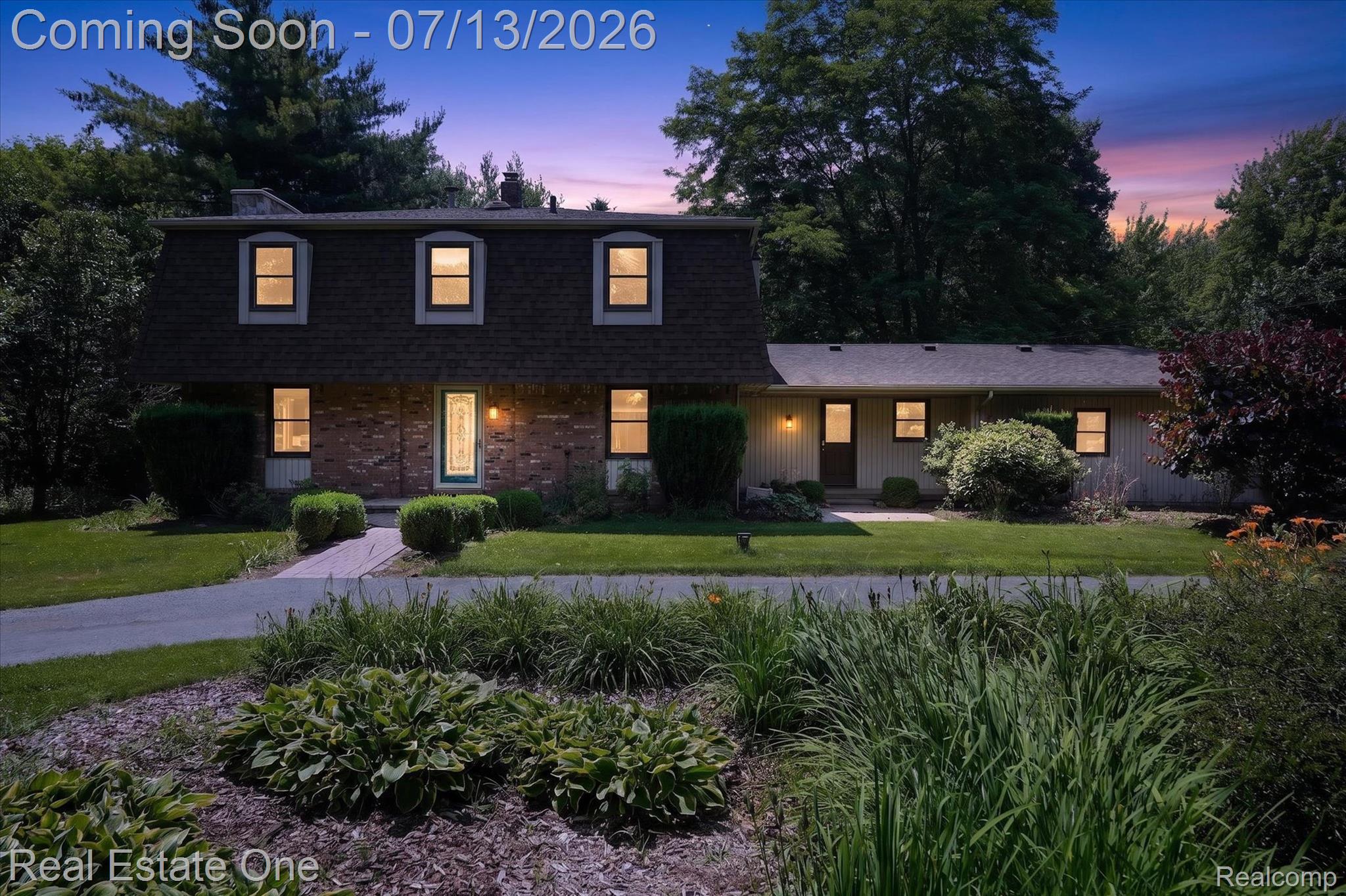 6039 Fish Lake Road Holly, MI 48442 - Photo 67 of 70 Dutch colonial with a chimney, a front yard, brick, vinyl & Cultured Stone siding, and a gabled style roof. Circular driveway with beautiful gardens.