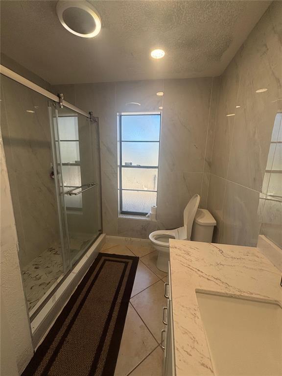 14208 Mayer Avenue Hudson, FL 34669 - Photo 11 of 29 a bathroom with a sink a toilet and shower
