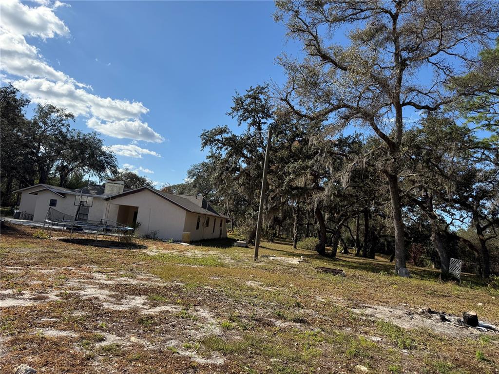 14208 Mayer Avenue Hudson, FL 34669 - Photo 19 of 29 a view of a house with a yard