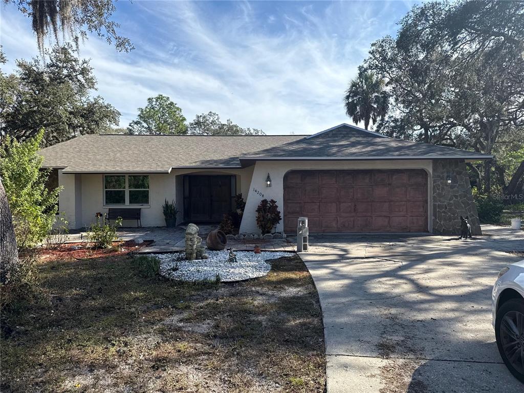 14208 Mayer Avenue Hudson, FL 34669 - Photo 2 of 29 a view of a house with backyard