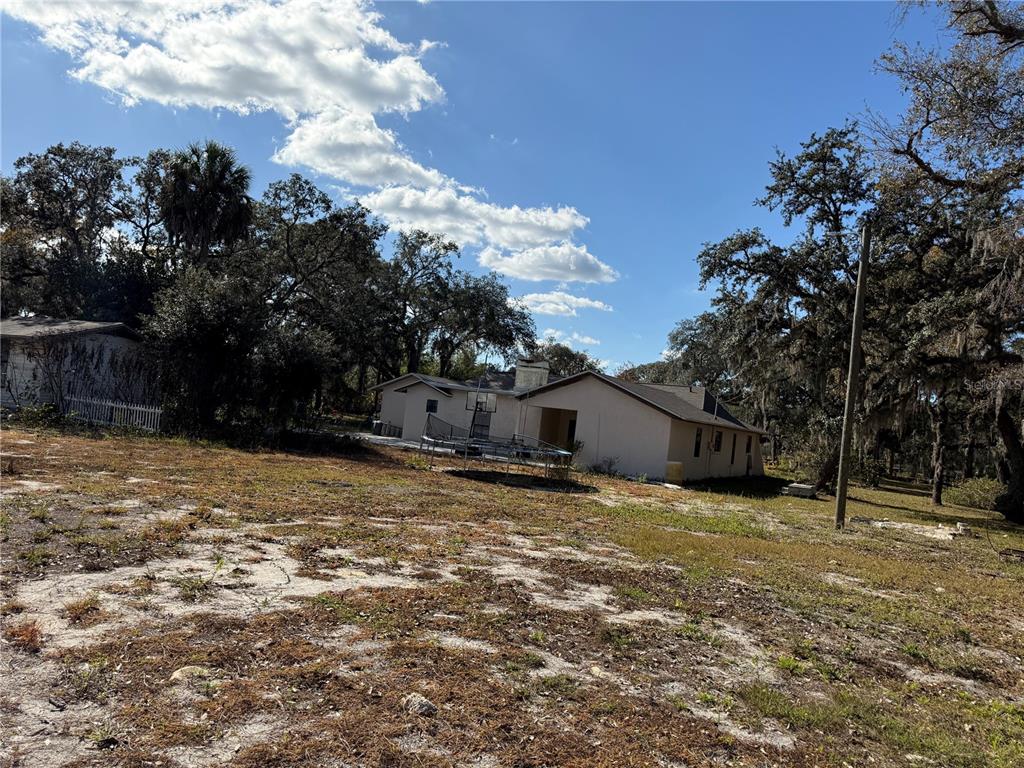 14208 Mayer Avenue Hudson, FL 34669 - Photo 23 of 29 a view of a house with a yard