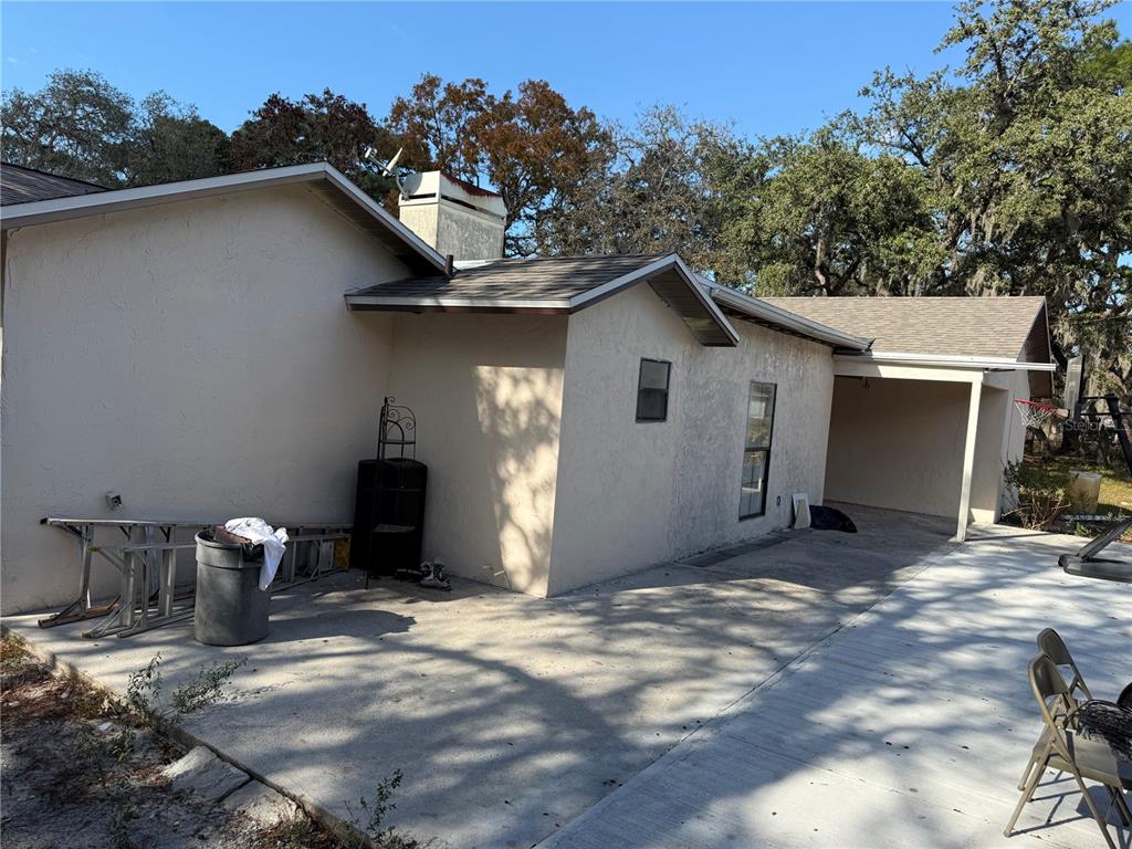 14208 Mayer Avenue Hudson, FL 34669 - Photo 25 of 29 a view of a house with a patio