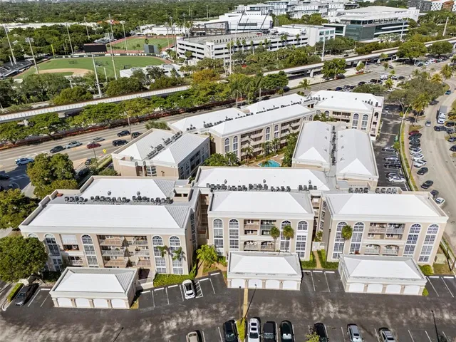 an aerial view of a residential houses with city view