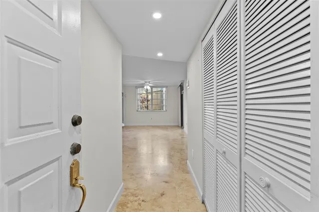 a view of a hallway with windows