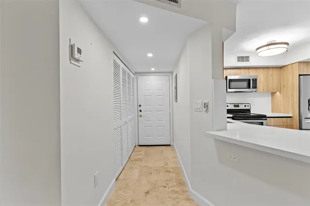 a view of a kitchen with a sink