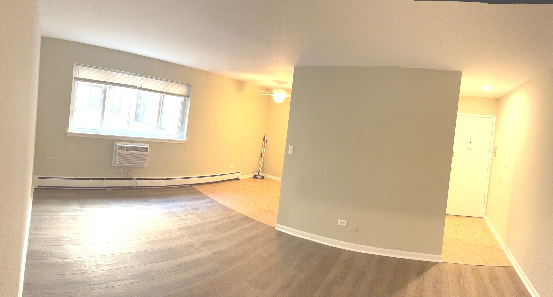 5420 North Kenmore Avenue, Unit 205 Chicago, IL 60640 - Photo 4 of 6 a view of a room with wooden floor and a window