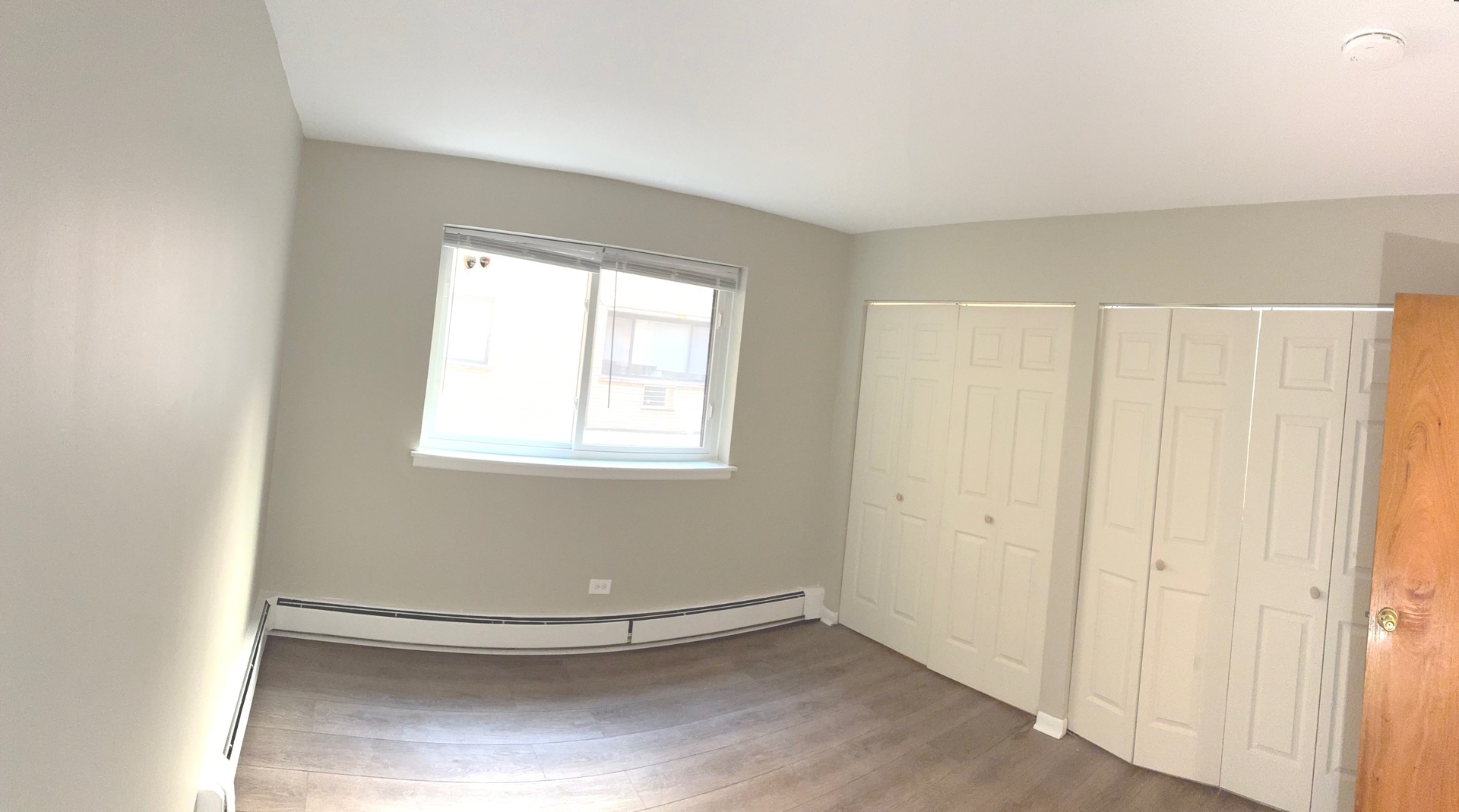 5420 North Kenmore Avenue, Unit 205 Chicago, IL 60640 - Photo 5 of 6 a view of an empty room with a window