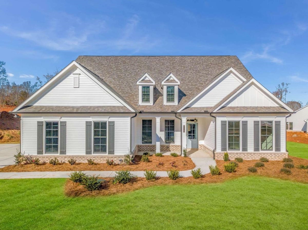 4185 Sewell Road, Unit 4 Cumming, GA 30028 - Photo 1 of 1 a front view of a house with a yard