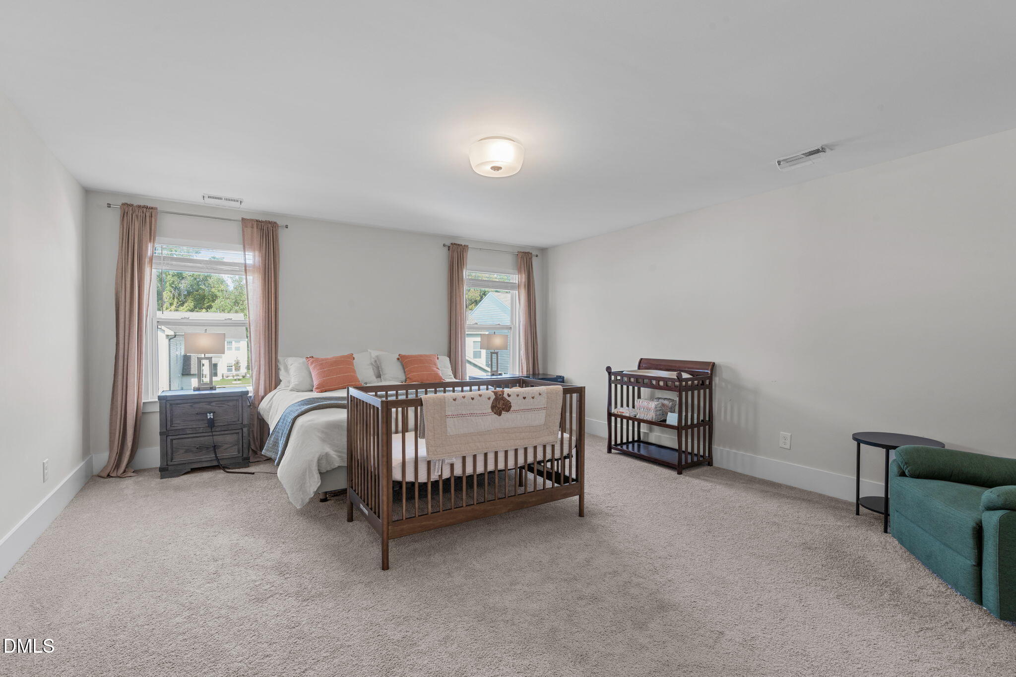 1400 Addison Lk Street Fuquay-Varina, NC 27526 - Photo 18 of 35 a bed sitting in a spacious bedroom next to a window