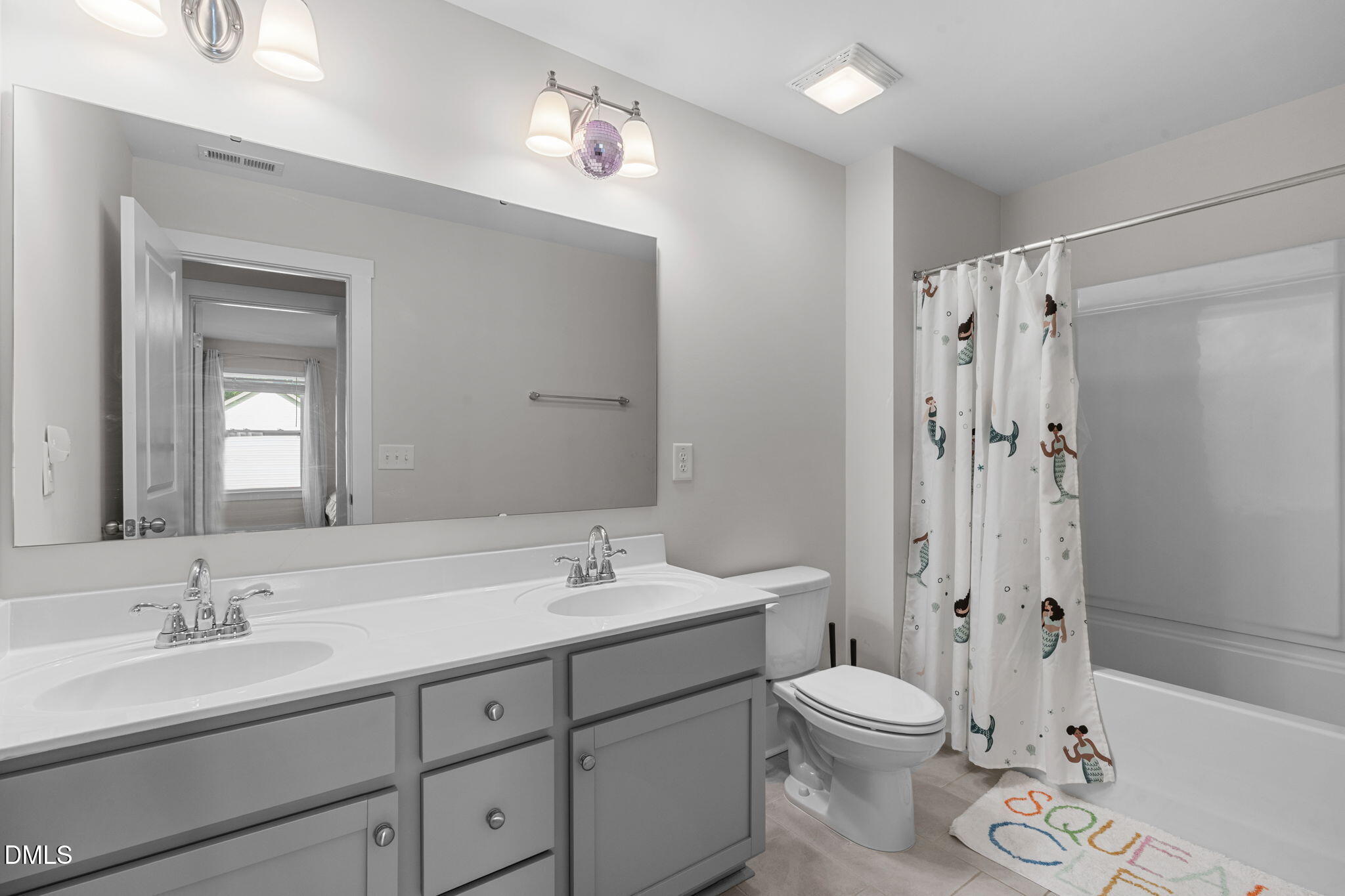 1400 Addison Lk Street Fuquay-Varina, NC 27526 - Photo 26 of 35 a bathroom with a double vanity sink toilet mirror and shower