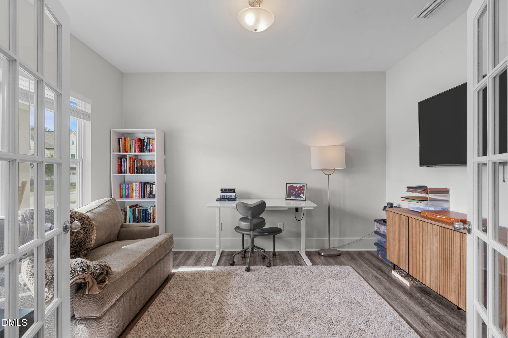 1400 Addison Lk Street Fuquay-Varina, NC 27526 - Photo 4 of 35 a living room with furniture and a flat screen tv