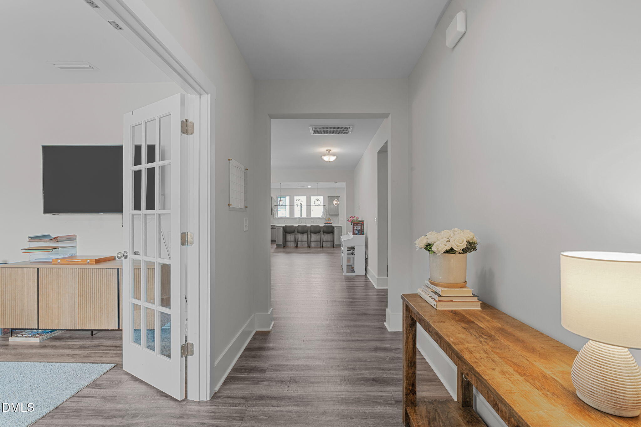 1400 Addison Lk Street Fuquay-Varina, NC 27526 - Photo 7 of 35 a living room with furniture and a flat screen tv