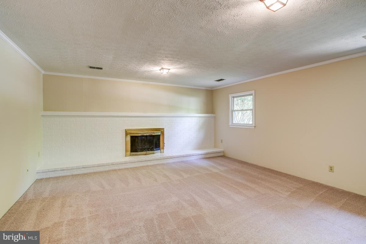 2409 Myrtle Lane Reston, VA 20191 - Photo 21 of 30 Family Room features raised hearth fireplace