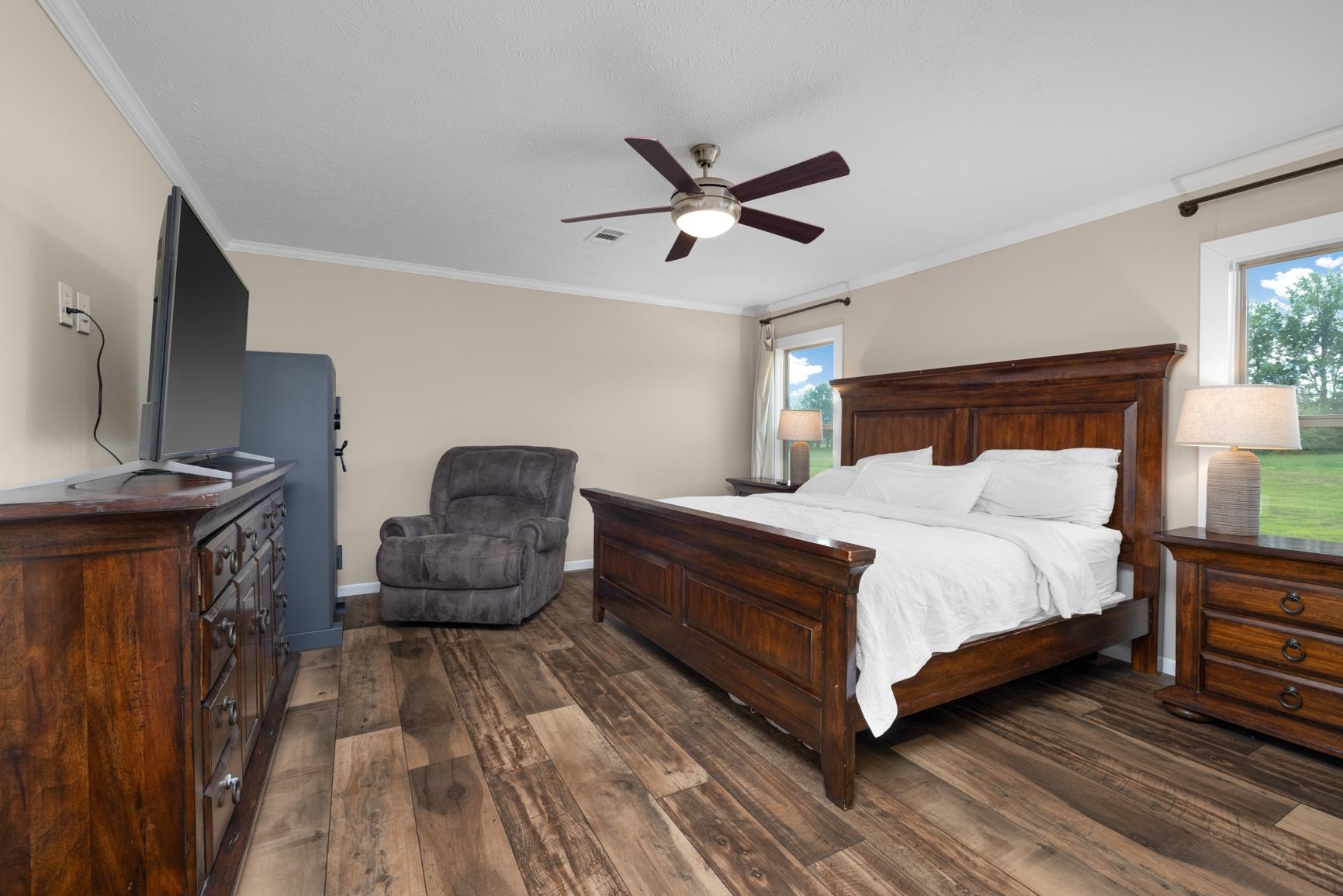 4044 Beaver Creek Road Mason, TN 38049 - Photo 14 of 36 Bedroom featuring wood finished floors, crown molding, baseboards, and a ceiling fan