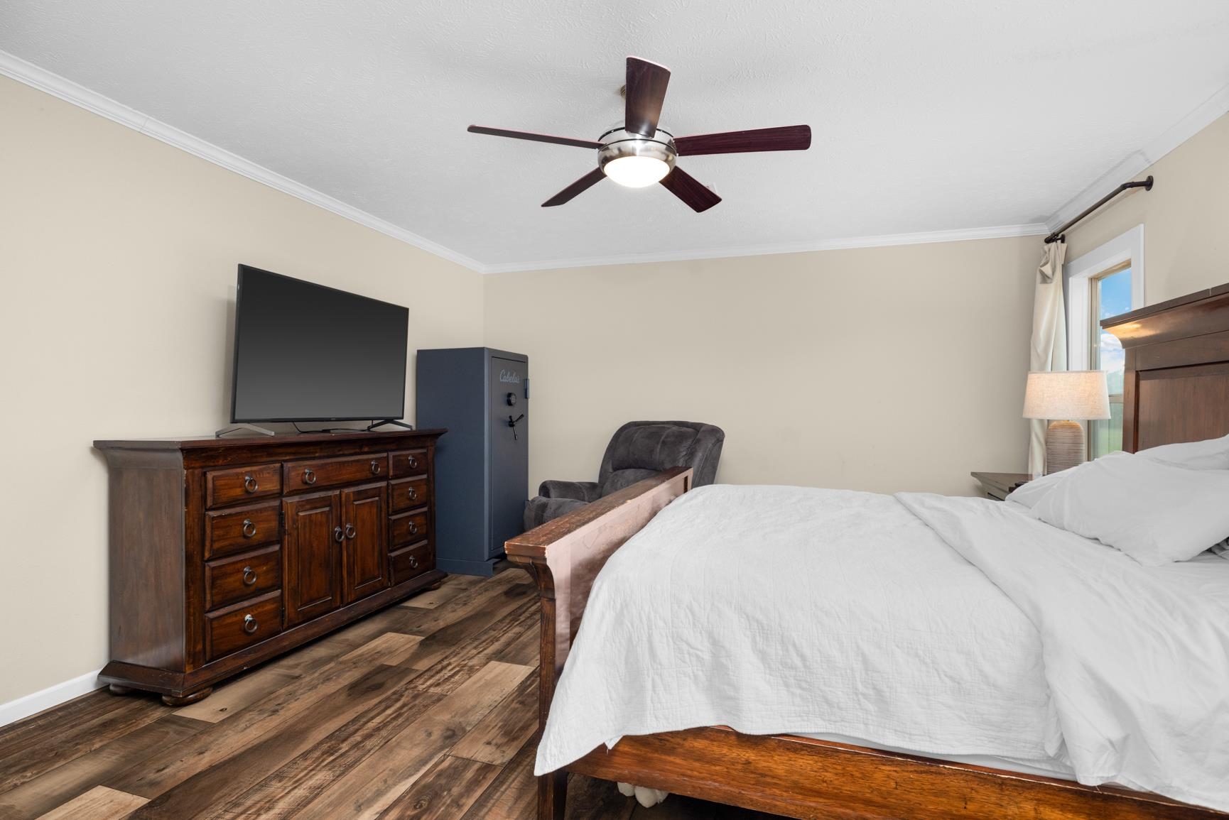 4044 Beaver Creek Road Mason, TN 38049 - Photo 15 of 36 Bedroom with dark wood-style floors, crown molding, baseboards, and a ceiling fan