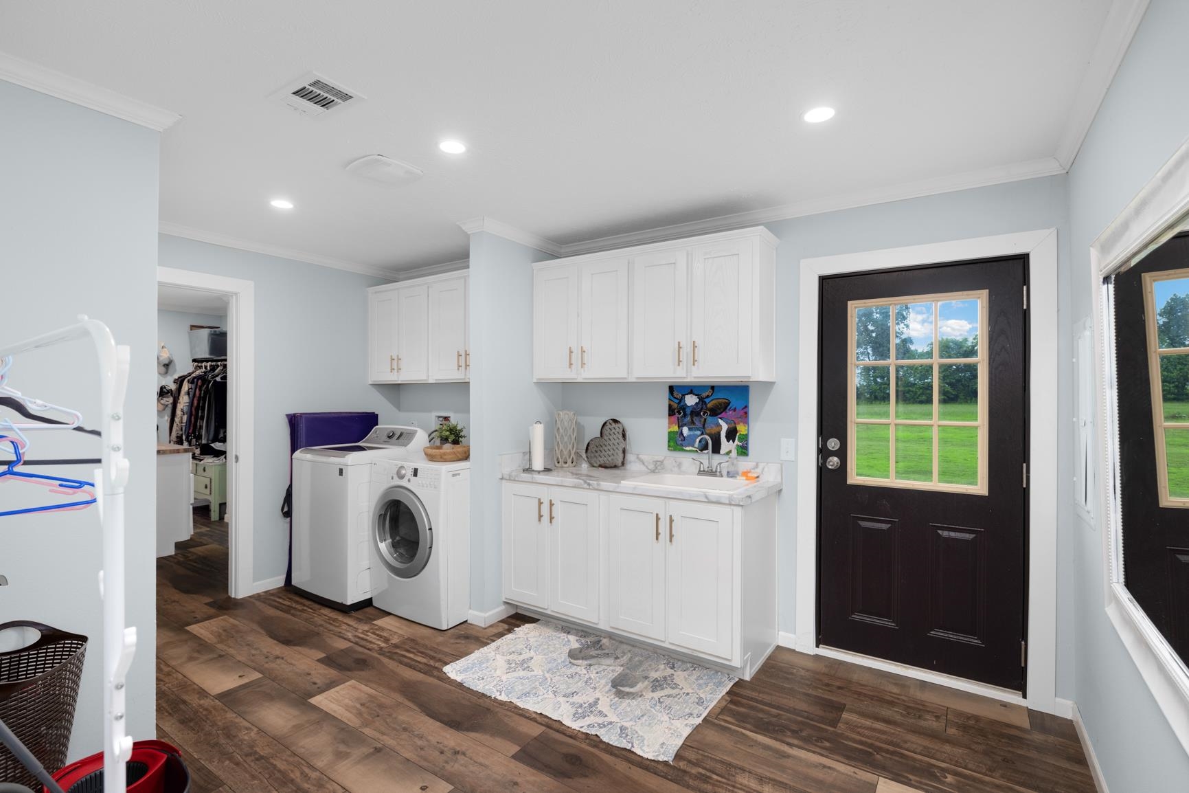4044 Beaver Creek Road Mason, TN 38049 - Photo 20 of 36 Laundry room featuring separate washer and dryer, cabinet space, crown molding, dark wood-type flooring, and recessed lighting