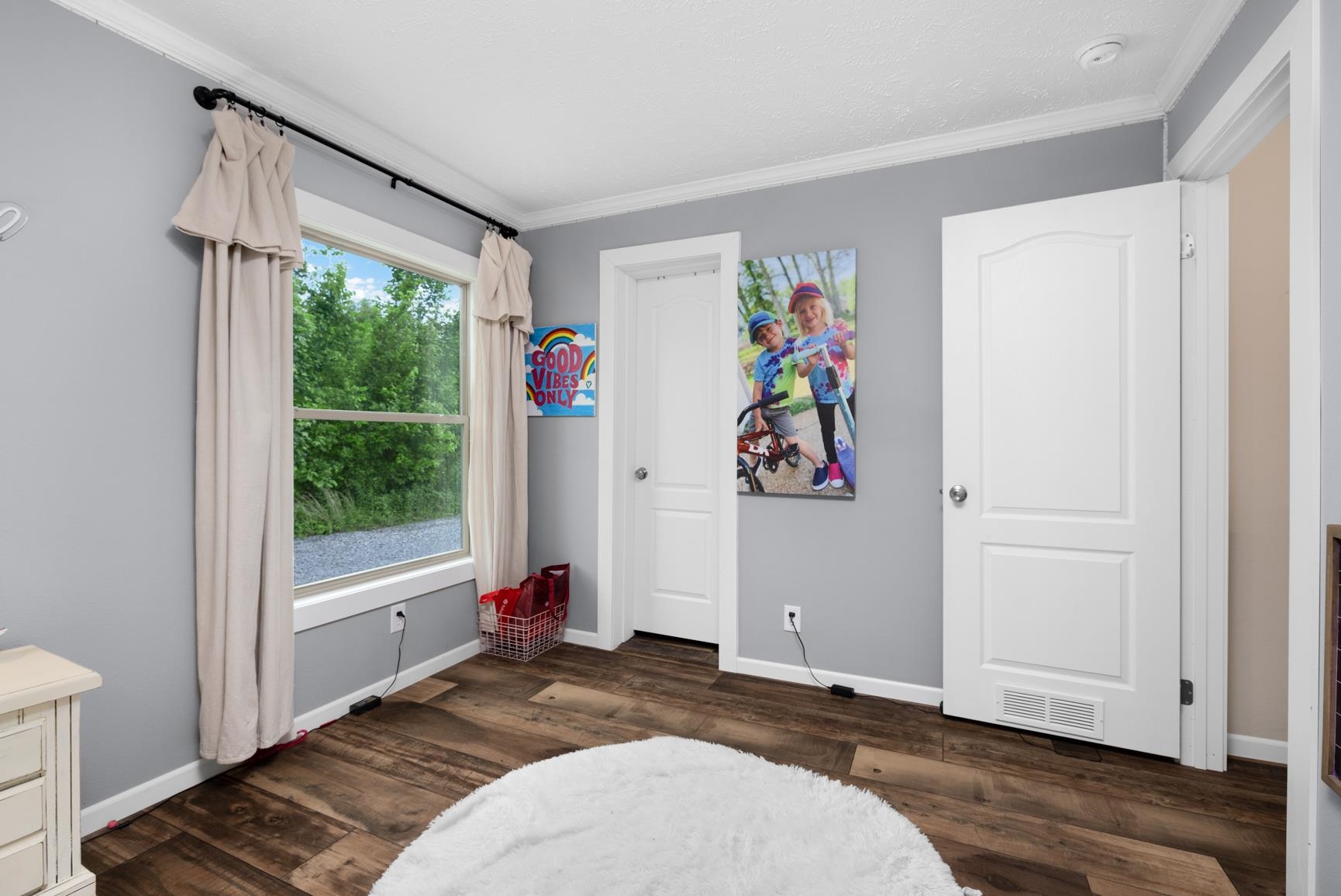 4044 Beaver Creek Road Mason, TN 38049 - Photo 26 of 36 Bedroom with ornamental molding, baseboards, and dark wood-type flooring