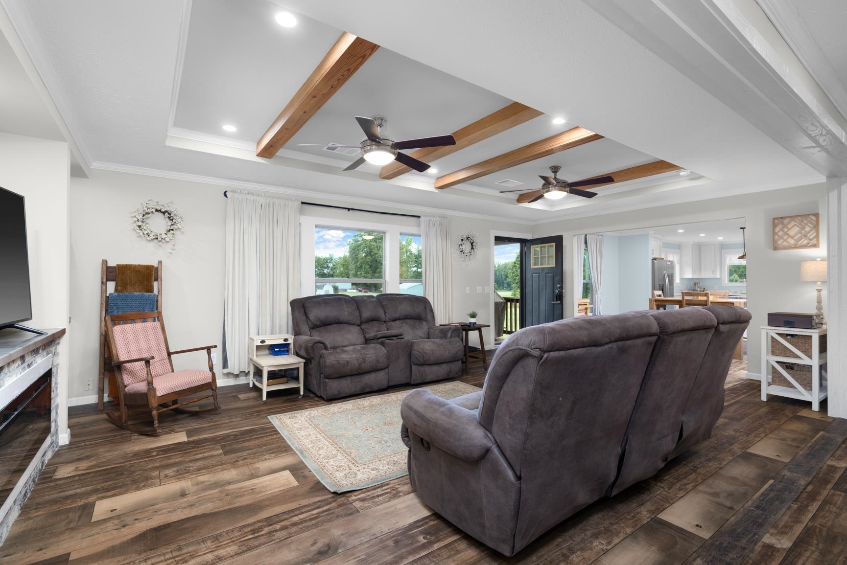 4044 Beaver Creek Road Mason, TN 38049 - Photo 5 of 36 Living area with ceiling fan, dark wood-style floors, recessed lighting, a tray ceiling, and beam ceiling