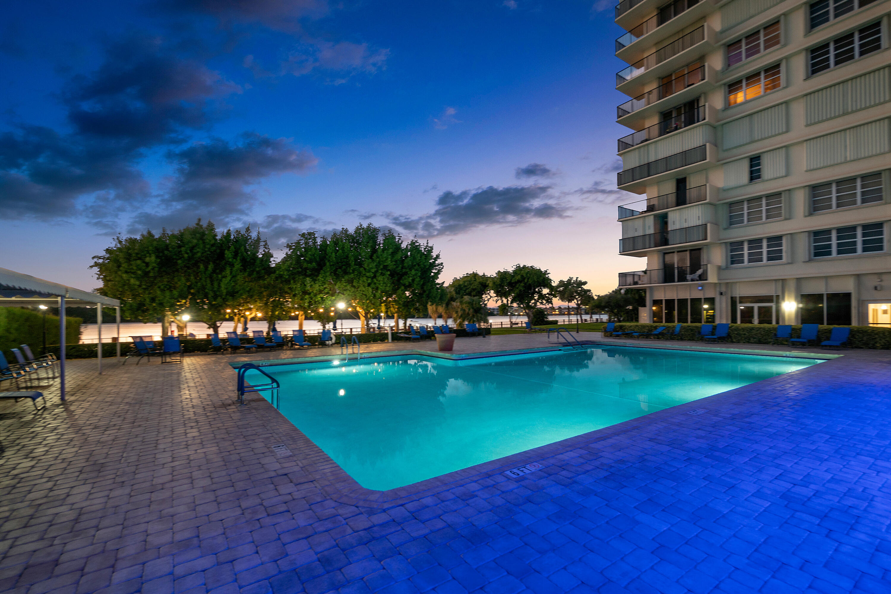 2121 North Ocean Boulevard, Unit 1103W Boca Raton, FL 33431 - Photo 36 of 55 Pool area in the evening