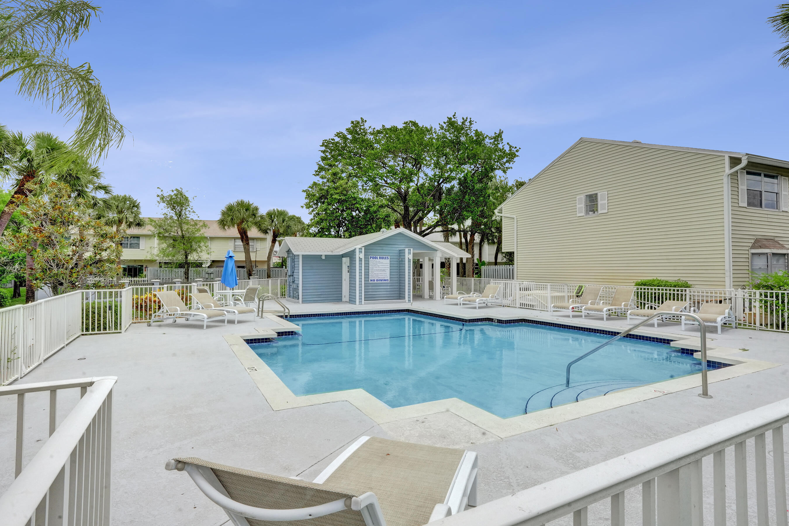 147 Southwest 3rd Street Pompano Beach, FL 33060 - Photo 25 of 29 a view of a house with pool and chairs