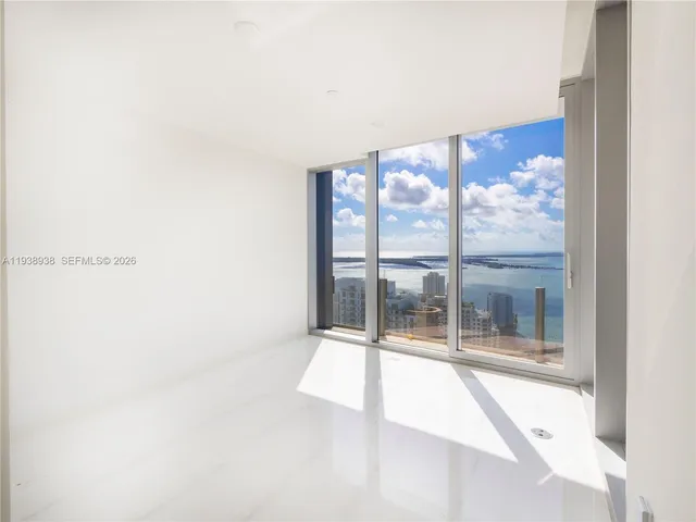 a view of an empty room with a large window