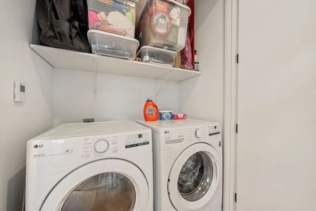 a view of a hallway with wooden floor and a potted plant