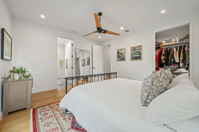 a bedroom with furniture and a window