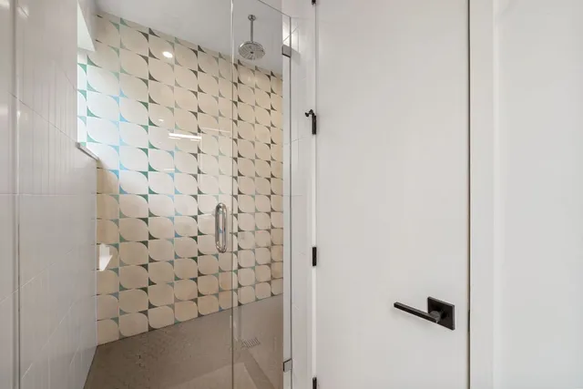 a bathroom with a sink double vanity and a mirror