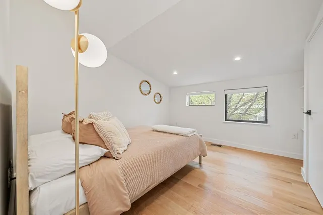 a living room with a couch and a window