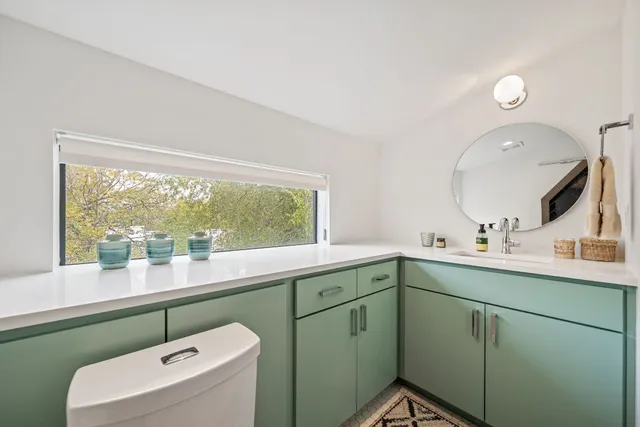 a bedroom with a bed and a cabinets