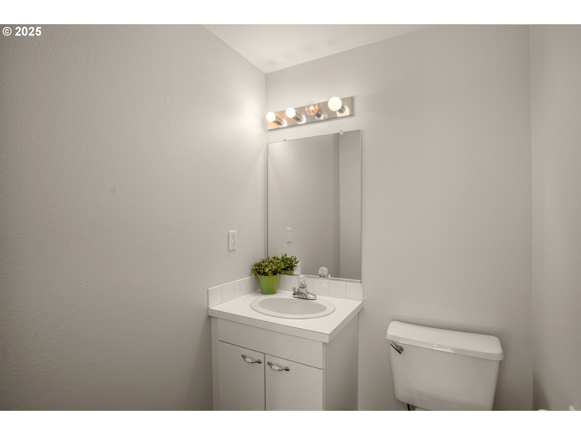 8123 Southwest Hearthside Court Portland, OR 97223 - Photo 13 of 19 a bathroom with a sink a mirror and a toilet