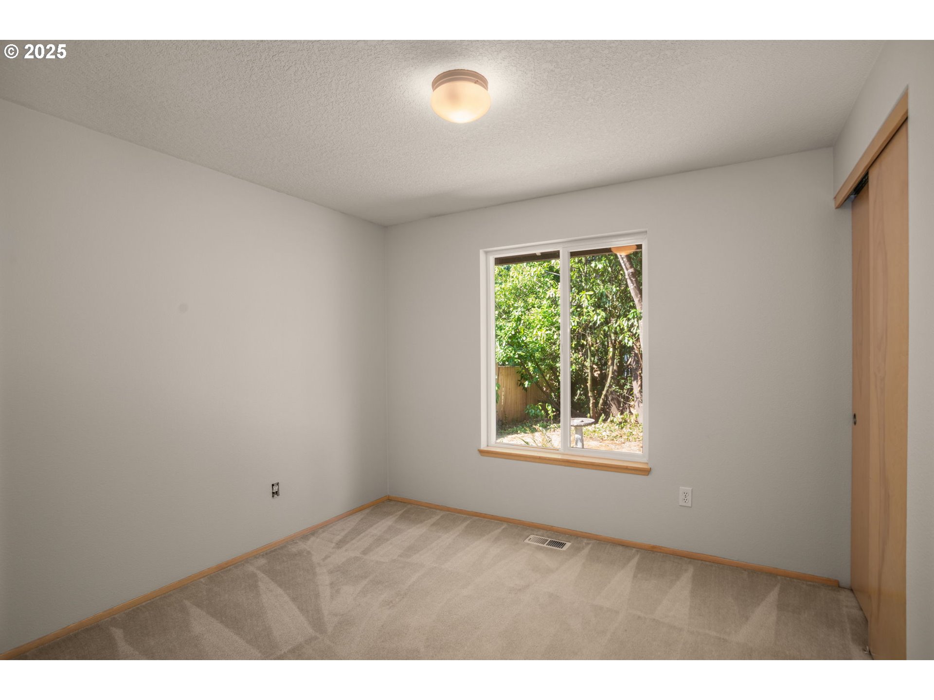 8123 Southwest Hearthside Court Portland, OR 97223 - Photo 15 of 19 a view of an empty room with a window